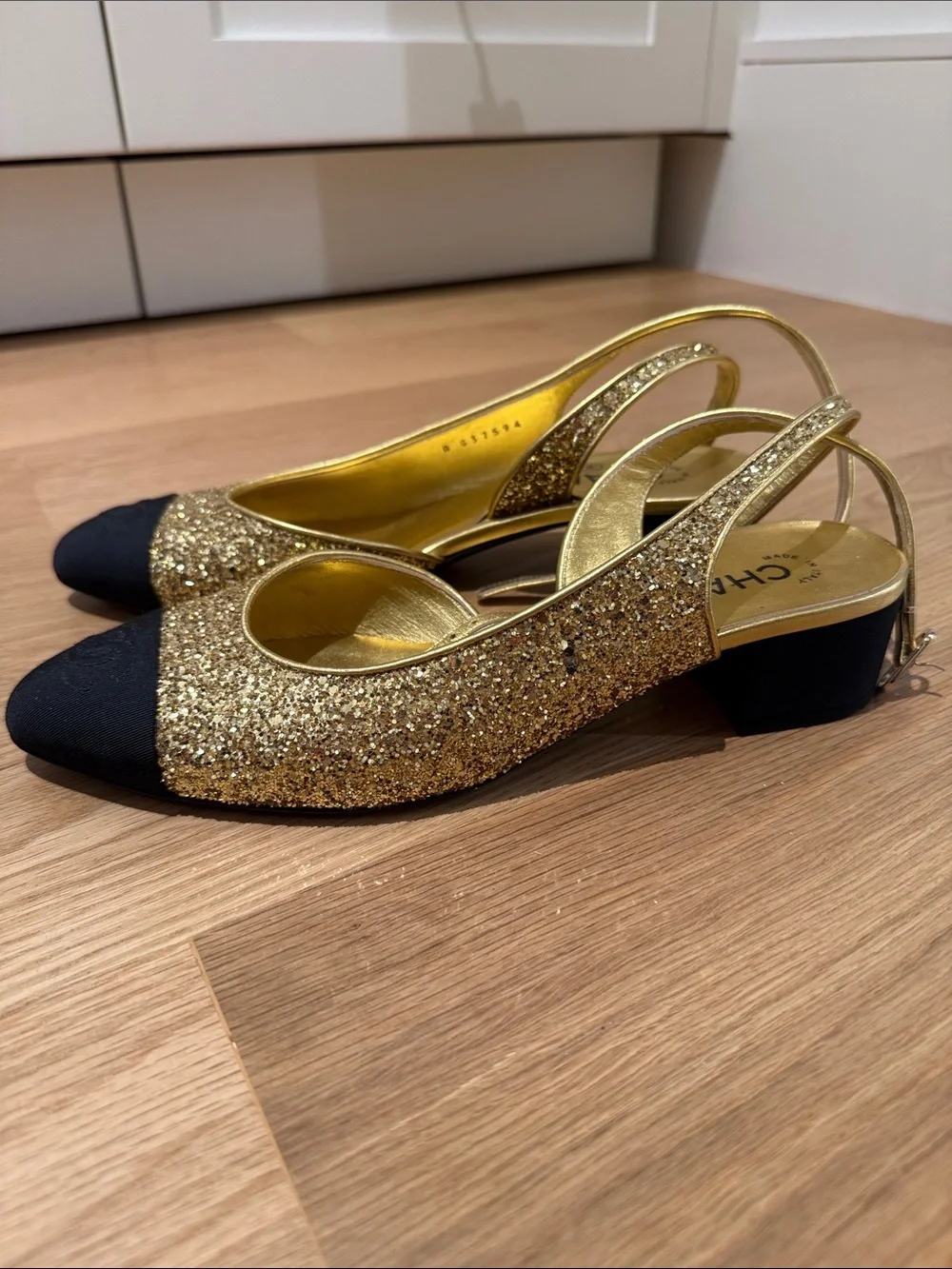 CHANEL Gold Glitter Slingback Mules with Black Cap Toe